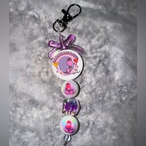 Purple and White Keychain with inside out Cartoon Design